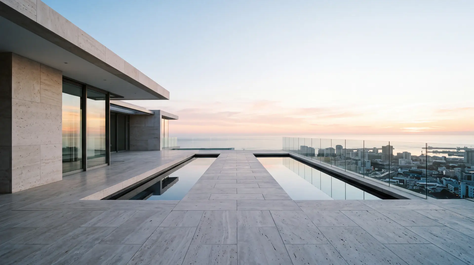 Stone and glass rooftop terrace overlooking a coastal city